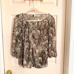 Brown semi sheer Jennifer Lopez top